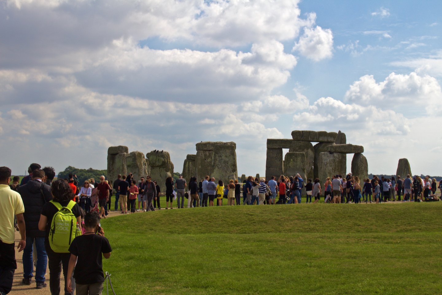 A crowd at Stonehenge on a summer day