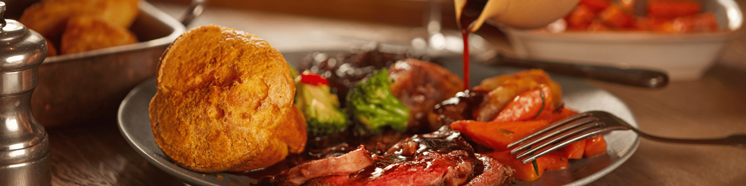 A dish with traditional beef roast with gravy