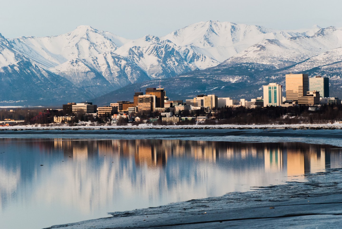 Downtown Anchorage, Alaska reflecting into Cook Inlet.