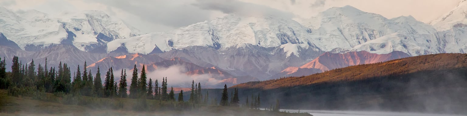 Snowy mountains and morning fog at Denali of Mt McKinley, Alaska