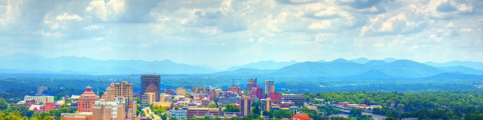 The Asheville skyline with the mountains in the background