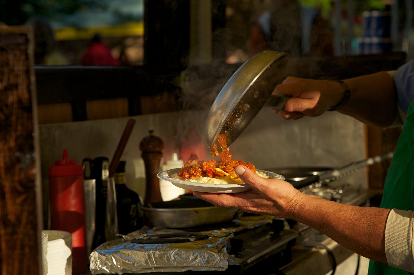 Shrimp and Grits being prepared at the Charleston Farmers Market.