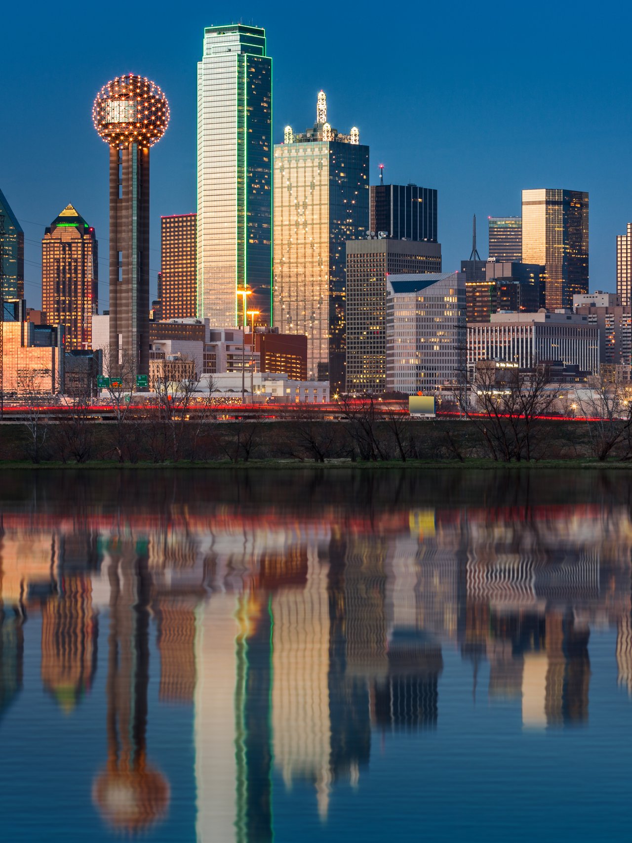 The skyline of Dallas reflected in the water at night