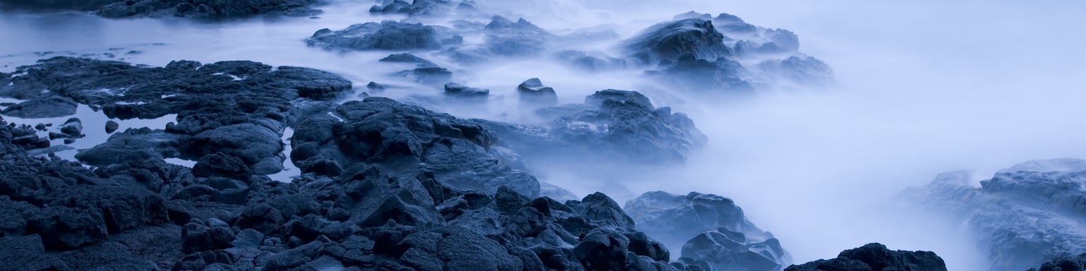 Waves crashing on lava rocks on the Big Island, Hawaii.