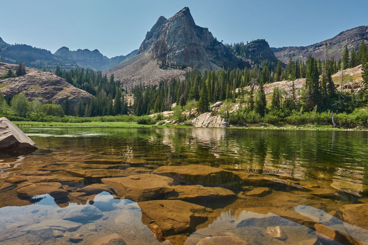 The clear waters of Lake Blanche surrounded by the Wasatch Mountains near Salt Lake City, Utah