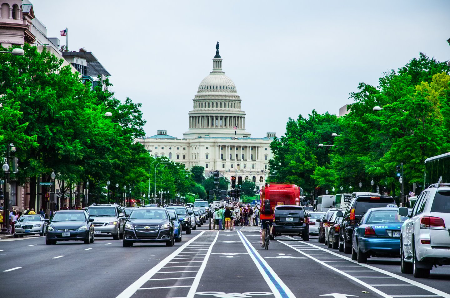 Cars in Washington DC with the Capitol building in the background