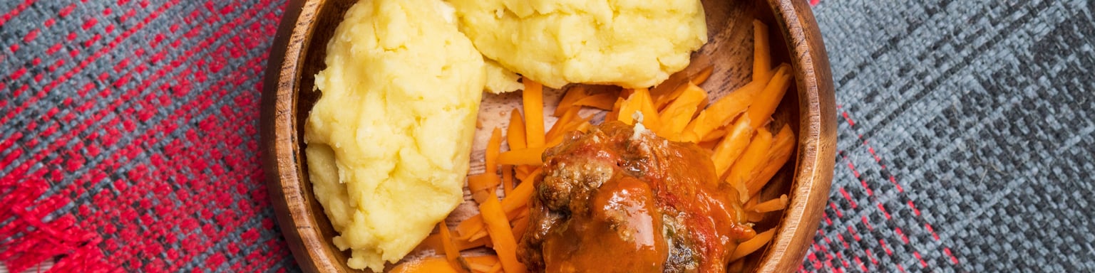 African maize porridge, nshima, with meat and sweet potatoes