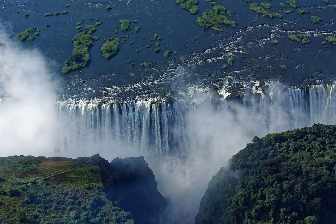 An aerial view of Victoria Falls with spray 