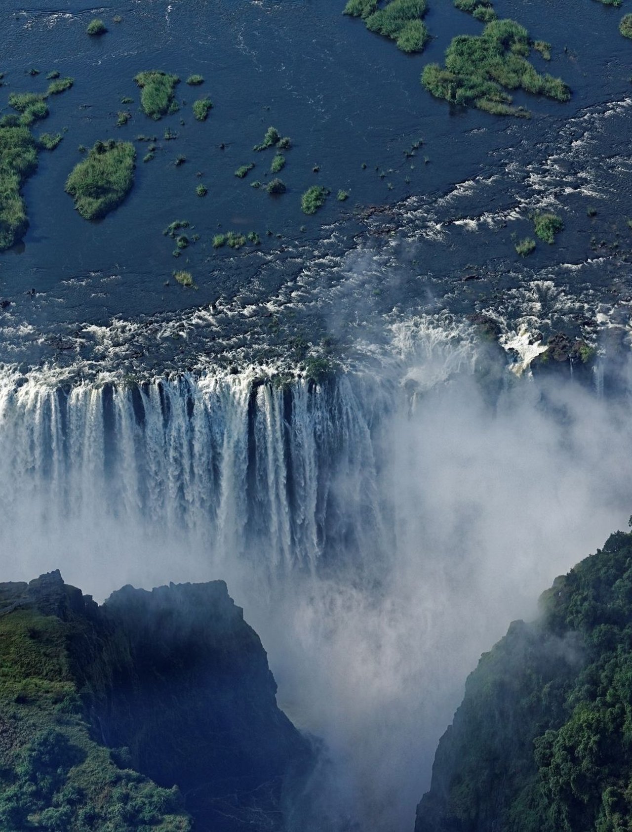 An aerial view of Victoria Falls with spray 