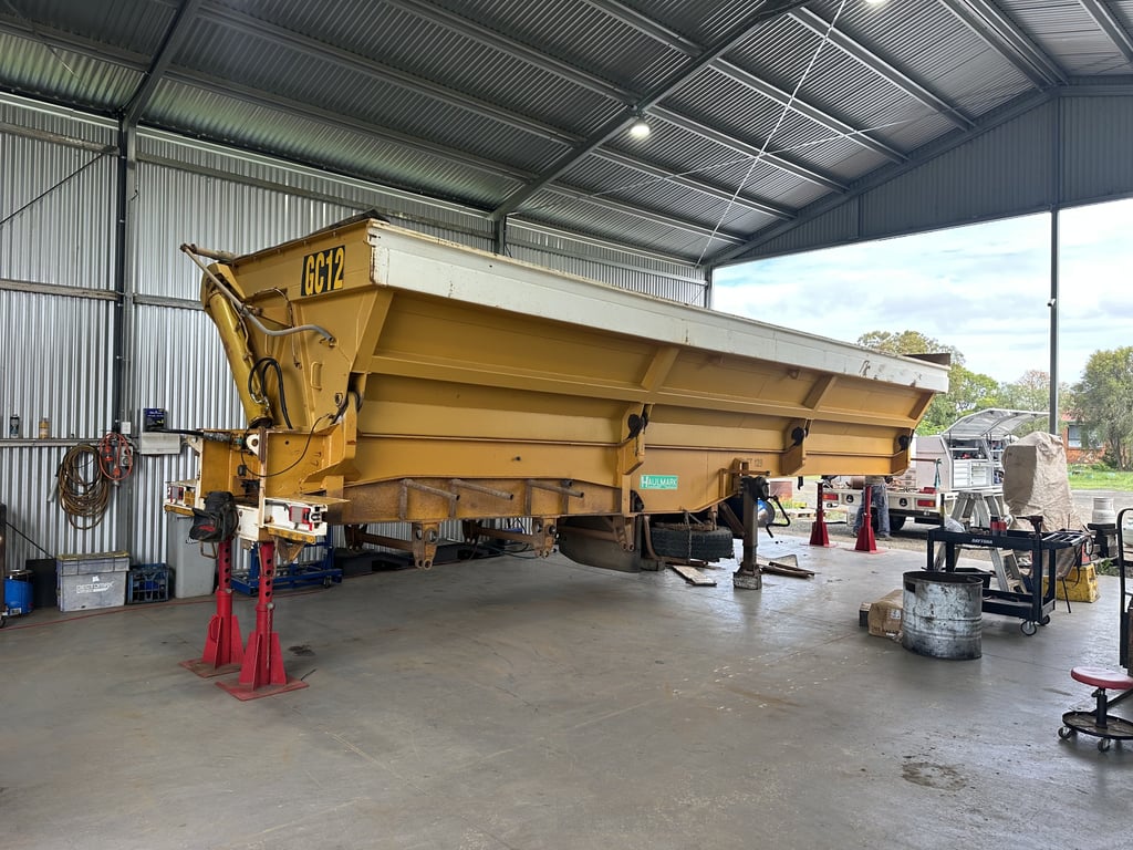 Heavy machinery before repair - extensive damage and wear