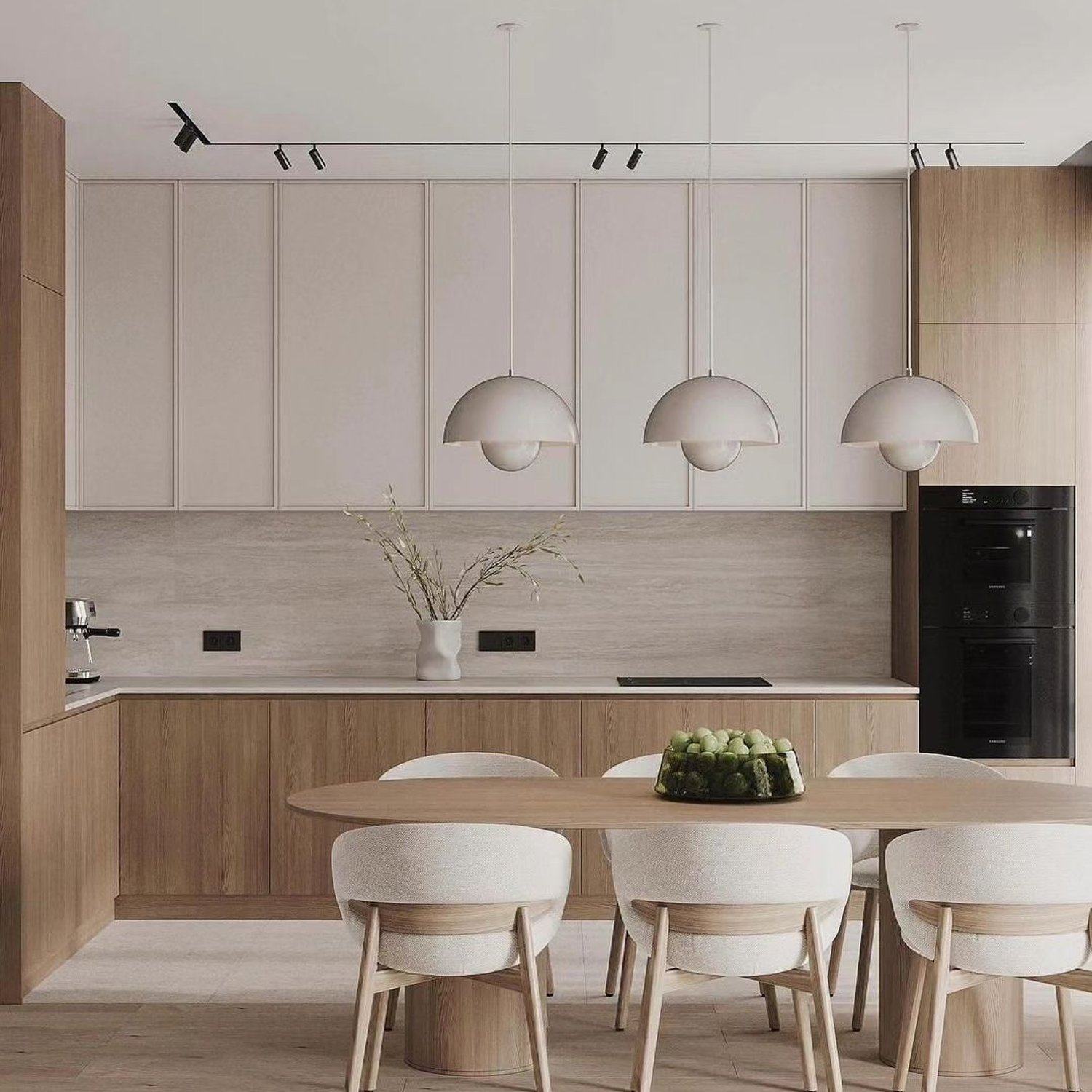 A tastefully designed minimalist kitchen with a blend of smooth textures and gentle colors