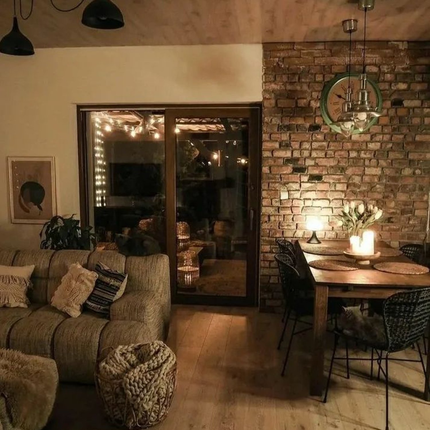 Cozy and rustic living room with brick accent wall and warm lighting