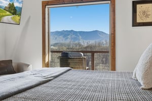 Wake up to breathtaking mountain views through your bedroom window, where majestic peaks create the perfect backdrop for your morning coffee.