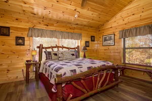Bedroom With Log Furniture at Anglers Ridge