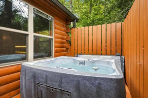 Slip into your private hot tub and let warm, bubbling water melt away tension as towering trees and natural privacy surround you.