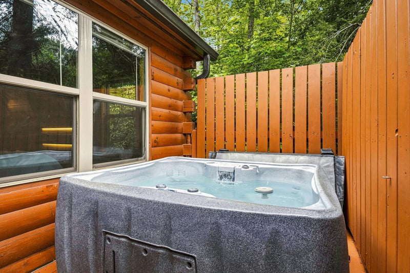 Slip into your private hot tub and let warm, bubbling water melt away tension as towering trees and natural privacy surround you.