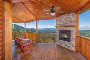 Outdoor fireplace and Rocking Chairs on the Covered Deck