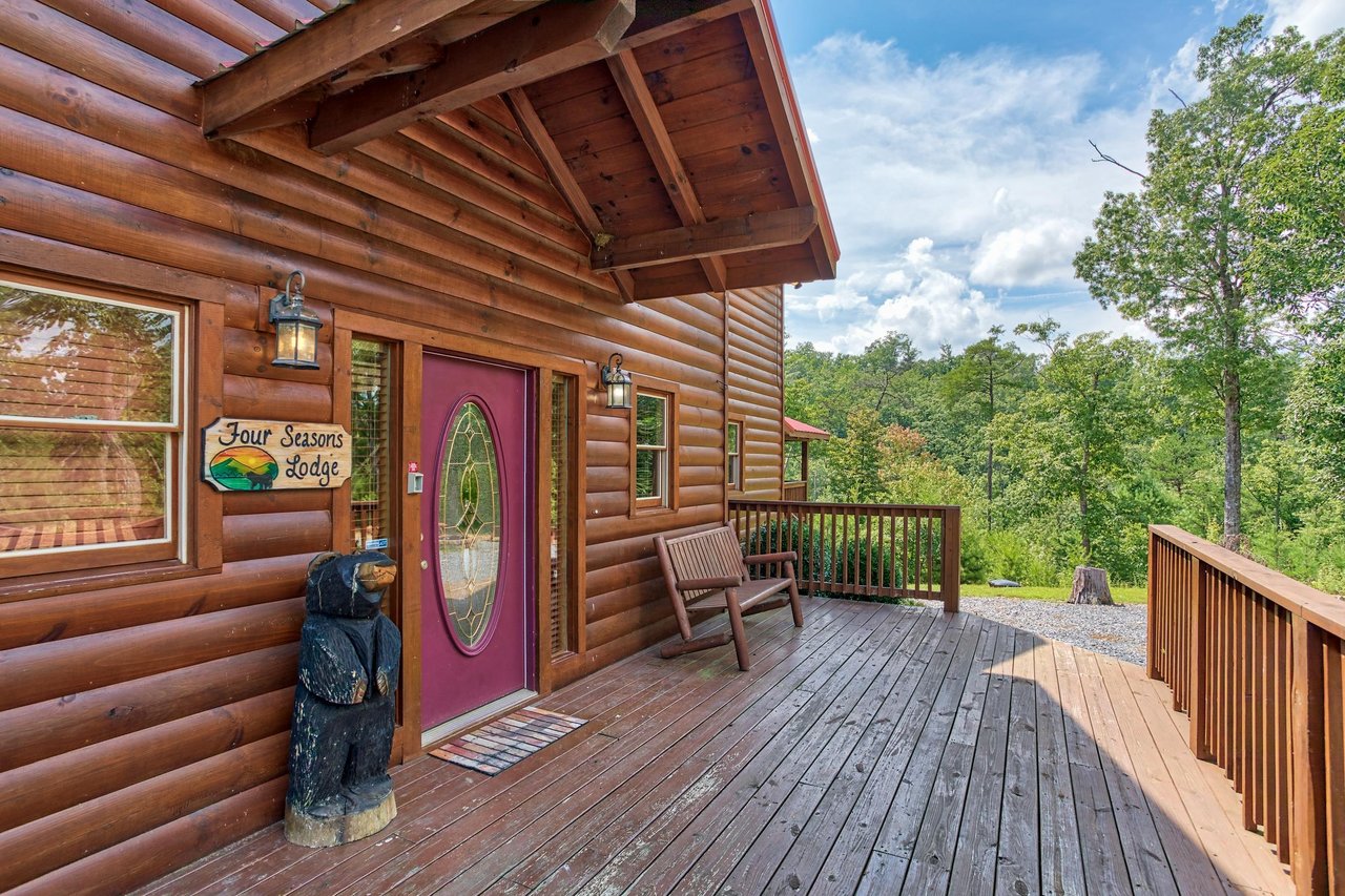Entry and front porch at Four Seasons Lodge, a 3bedroom cabin rental located in Pigeon Forge