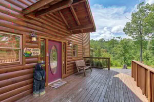 Entry and front porch at Four Seasons Lodge, a 3bedroom cabin rental located in Pigeon Forge