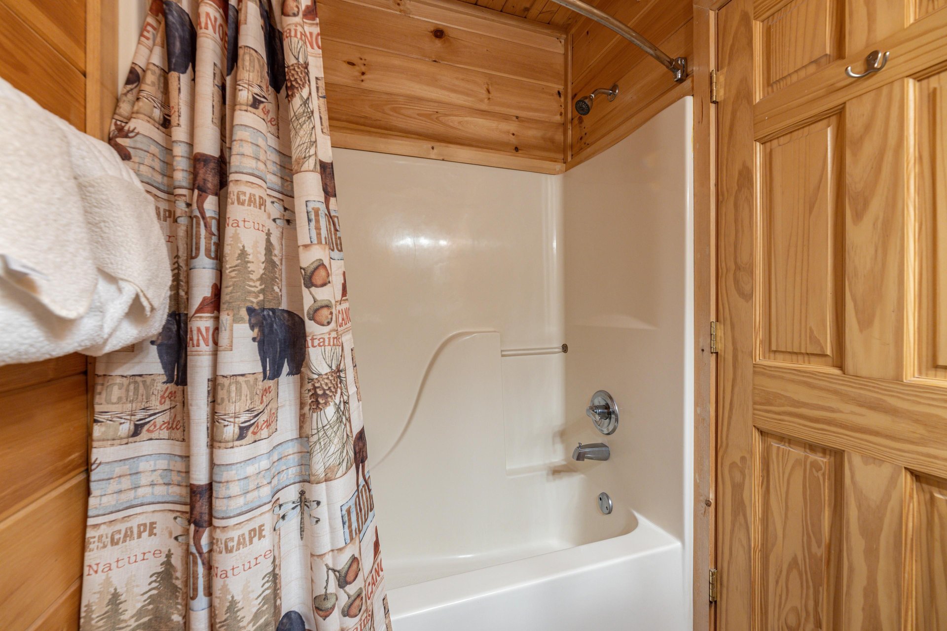 Bathroom with a tub and shower at Absolutely Wonderful, a 2 bedroom cabin rental located in Pigeon Forge