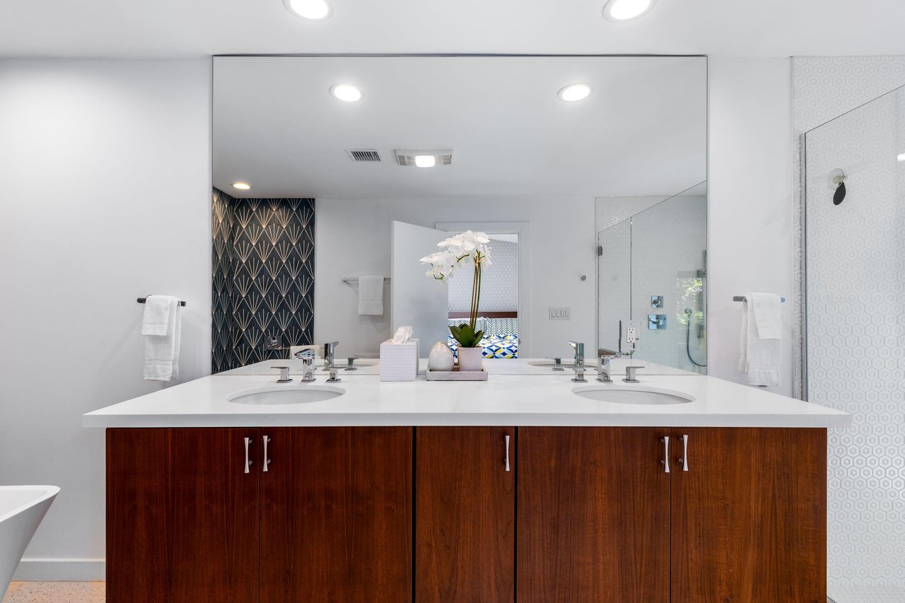 Dual vanity sinks and a walkin shower.