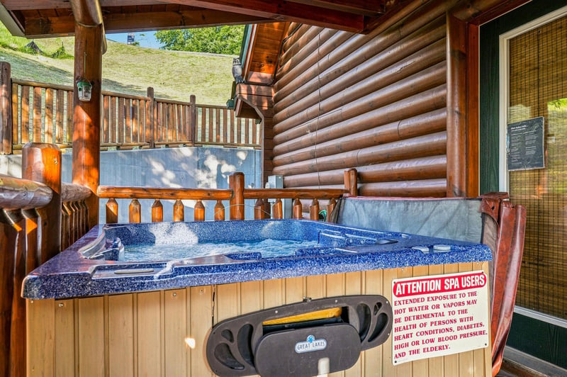 Slip into your private hot tub on the covered deck, where mountain views and warm bubbles create your perfect escape after a day of adventure.