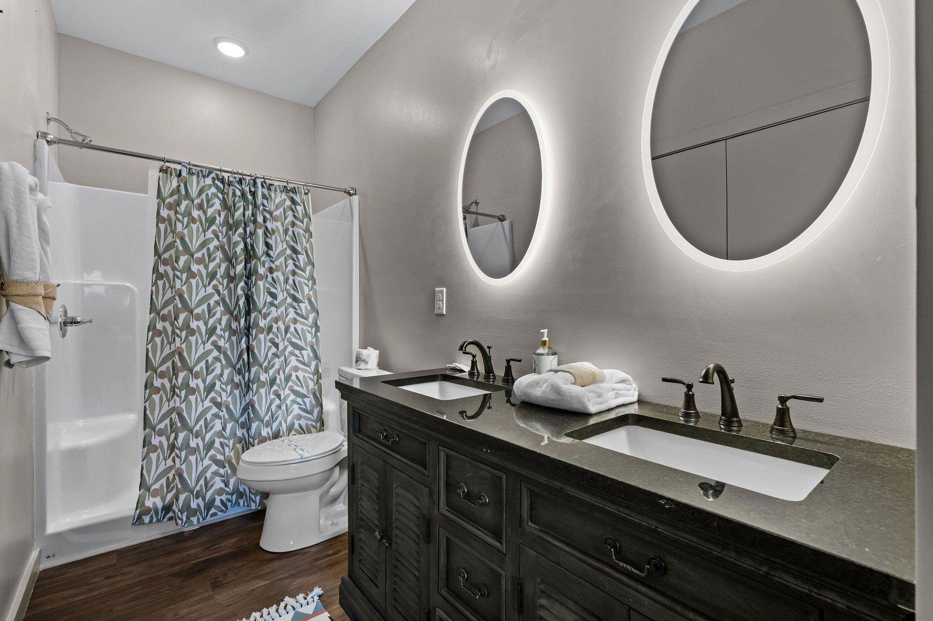 Double vanity with round lit mirrors