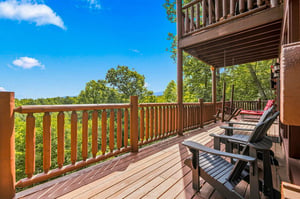 Soak in the peaceful forest views from your private balcony, where Adirondack chairs invite you to sip morning coffee or unwind as the sun sets over the treetops.