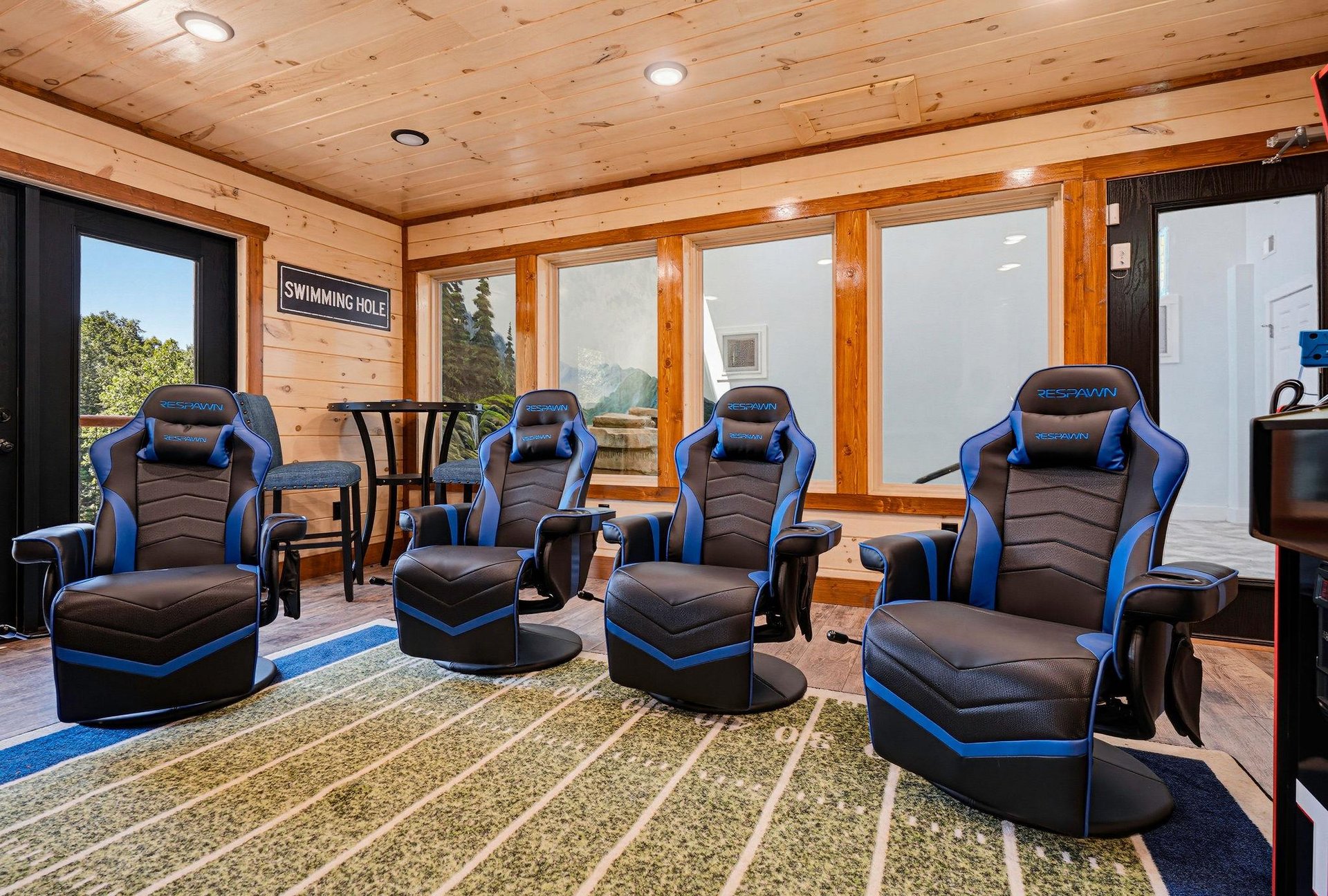 Kick back in your own private media room with four premium gaming chairs and footrests, perfect for movie marathons or competitive game nights with friends and family.