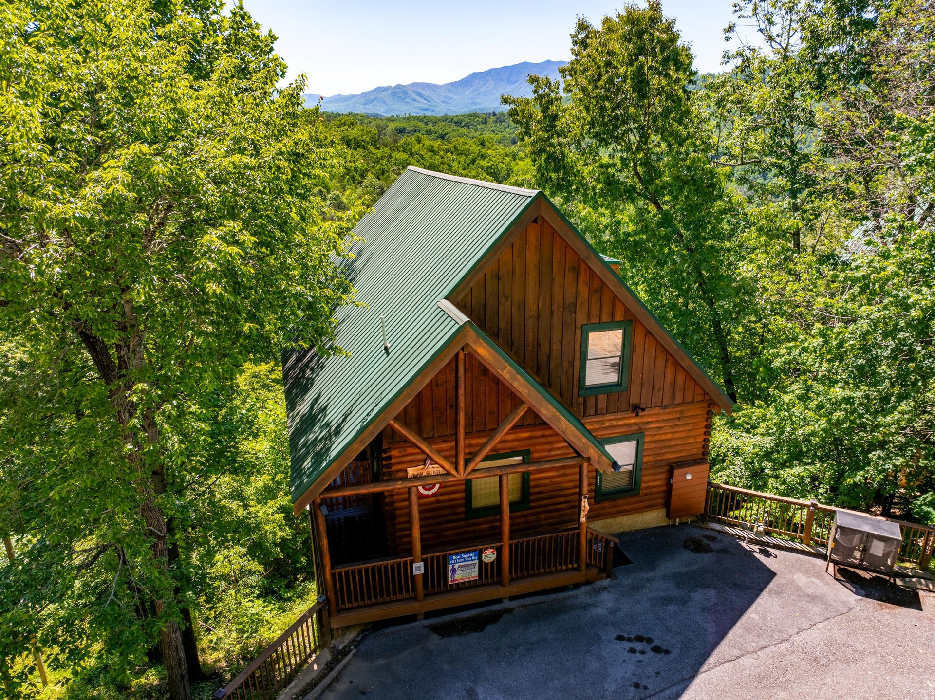 Nestled in lush forest with stunning mountain views, this charming log cabin offers a peaceful retreat surrounded by natures beauty and tranquil woodland serenity.