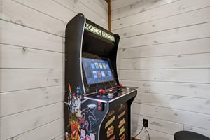 Challenge friends to classic arcade battles with this vintage game console featuring hundreds of retro games in your cozy corner.