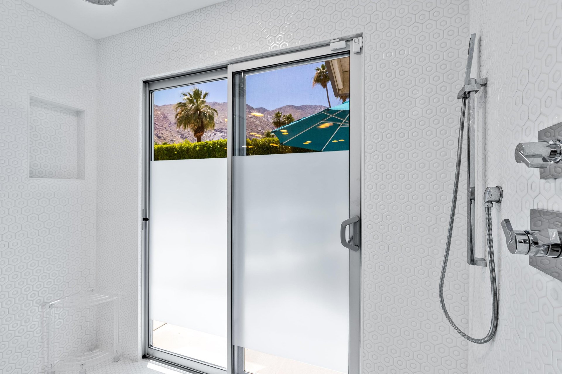 Access to the back patio located in the shower, perfect for rinsing off after a day by the pool and spa.