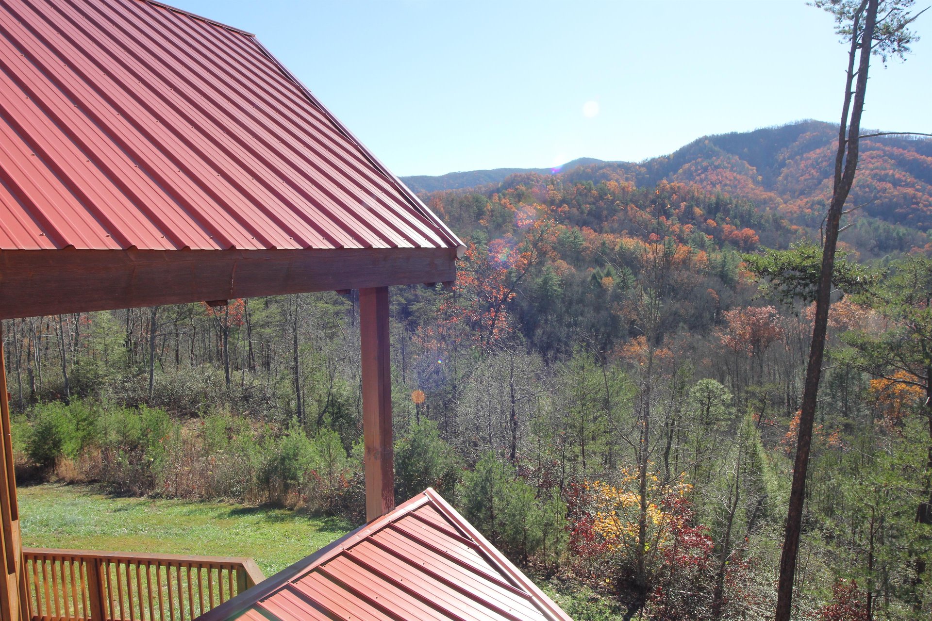 Fall colors seen from the upper deck at Four Seasons Lodge, a 3bedroom cabin rental located in Pigeon Forge