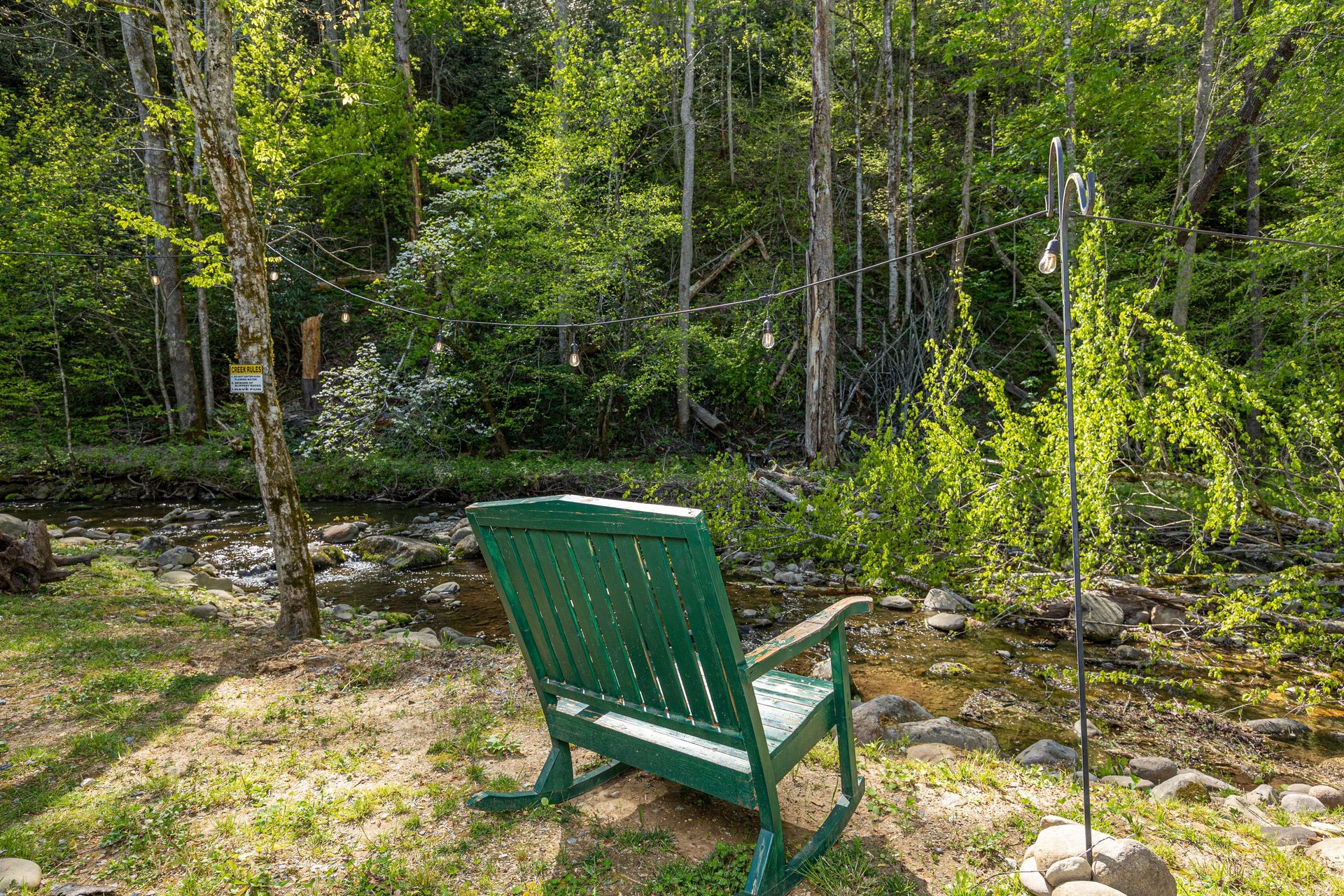 Rocking bench facing creek