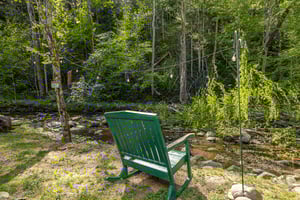 Rocking bench facing creek