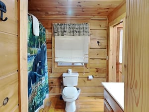 Warm pine walls and natural light create a cozy retreat where you can refresh in comfort after your mountain adventures.