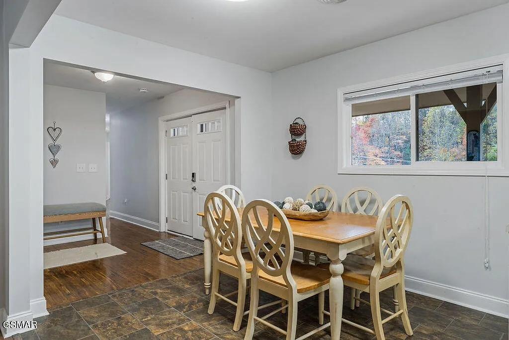 Gather around this elegant dining table where memories are made over shared meals, with beautiful autumn views through your window.