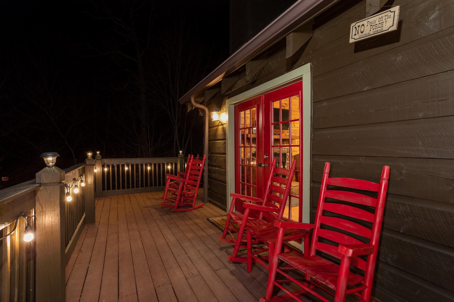 Outdoor wooden rocking chairs with lighted deck