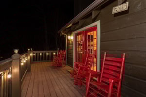 Outdoor wooden rocking chairs with lighted deck