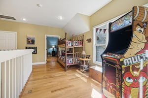Youll find your own classic arcade game waiting upstairs—imagine the family fun and friendly competition in this playful bunk room bathed in natural light.