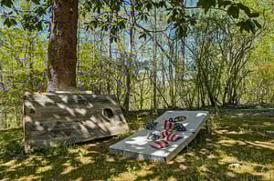 Unwind on your private sunbeds beneath dappled shade, where striped cushions invite afternoon relaxation in this peaceful garden sanctuary.