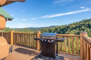 Propane grill on a deck overlooking the Smoky Mountains at Great View Lodge, a 5bedroom cabin rental located in Pigeon Forge