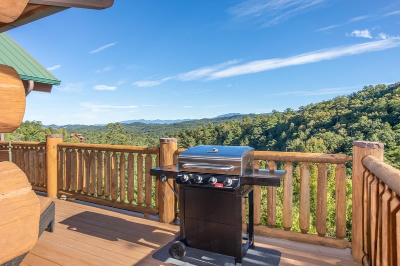 Propane grill on a deck overlooking the Smoky Mountains at Great View Lodge, a 5bedroom cabin rental located in Pigeon Forge