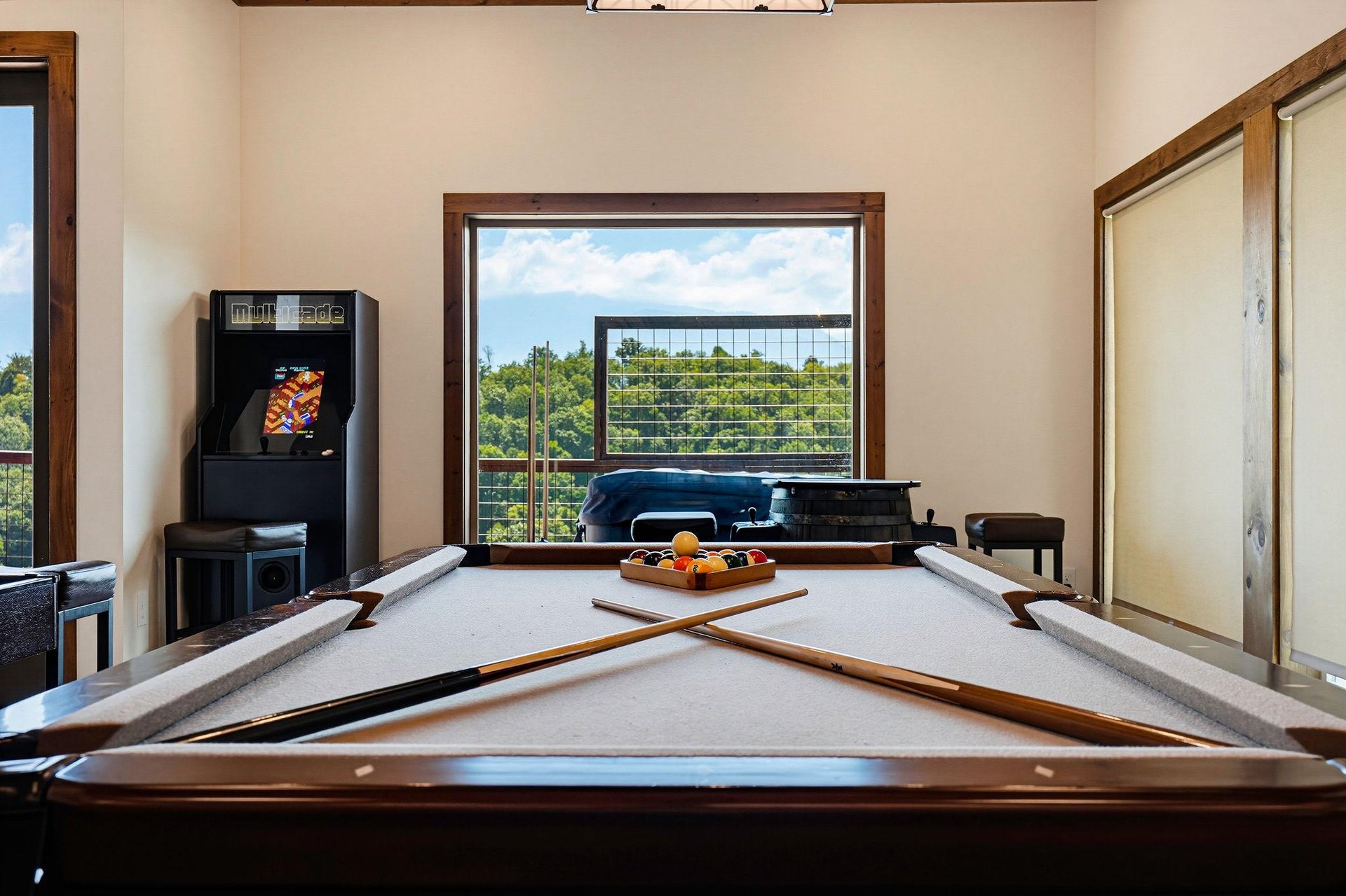 Challenge your friends to a game of pool in this inviting space, where natural light and peaceful views make every moment feel like a miniretreat.