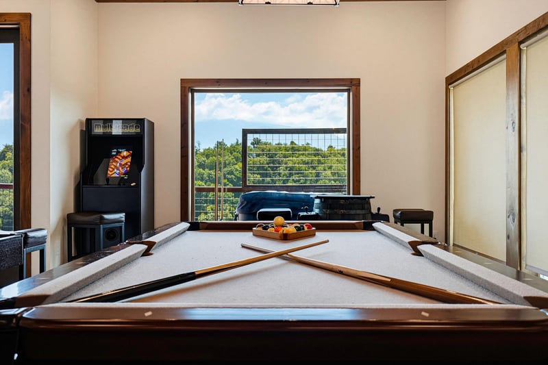 Challenge your friends to a game of pool in this inviting space, where natural light and peaceful views make every moment feel like a miniretreat.
