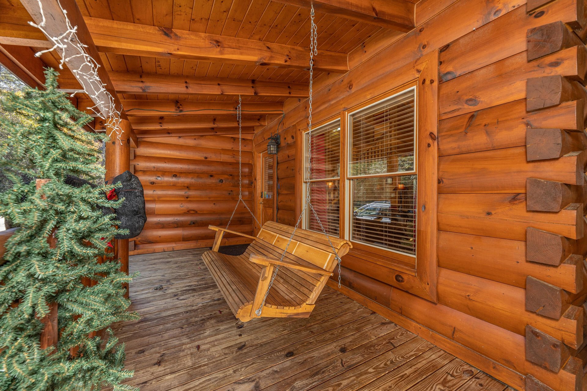 Porch swing at Bears Dont Bluff, a 3 bedroom cabin rental located in Pigeon Forge