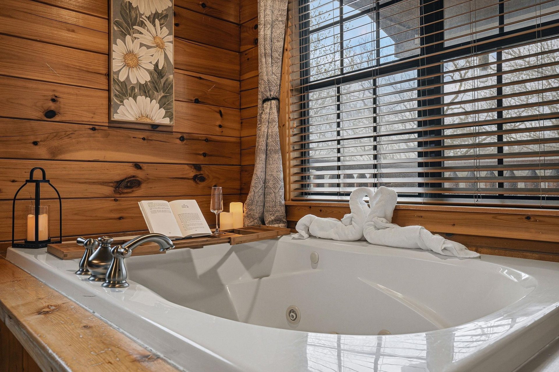 Unwind in your private jetted tub surrounded by warm wood walls, where thoughtful touches await your romantic getaway.