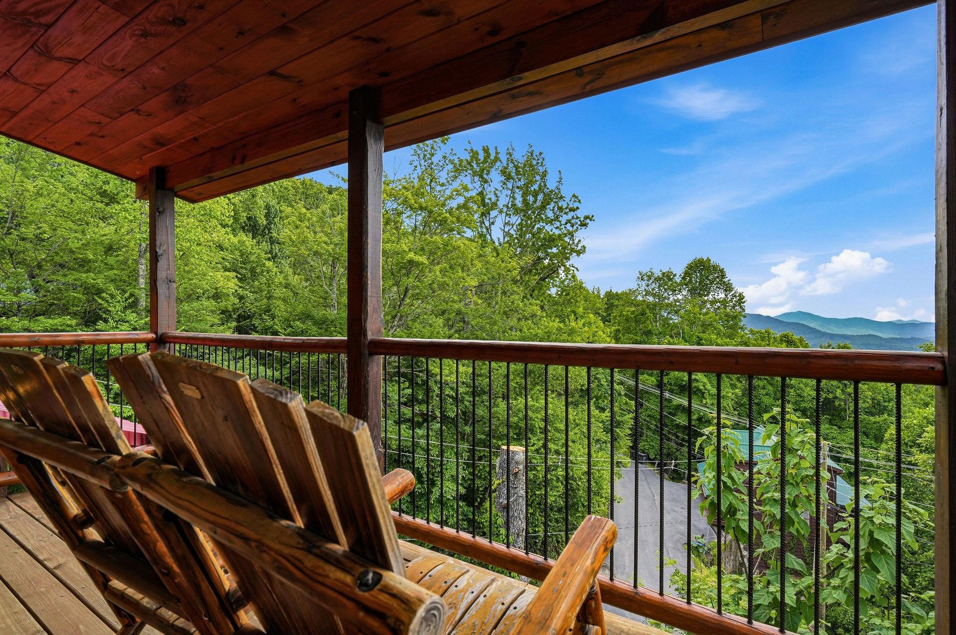 Sink into handcrafted log chairs and soak up sweeping mountain views framed by lush greenery. This peaceful balcony is your frontrow seat to natures beauty.