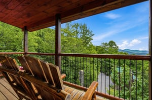 Sink into handcrafted log chairs and soak up sweeping mountain views framed by lush greenery. This peaceful balcony is your frontrow seat to natures beauty.