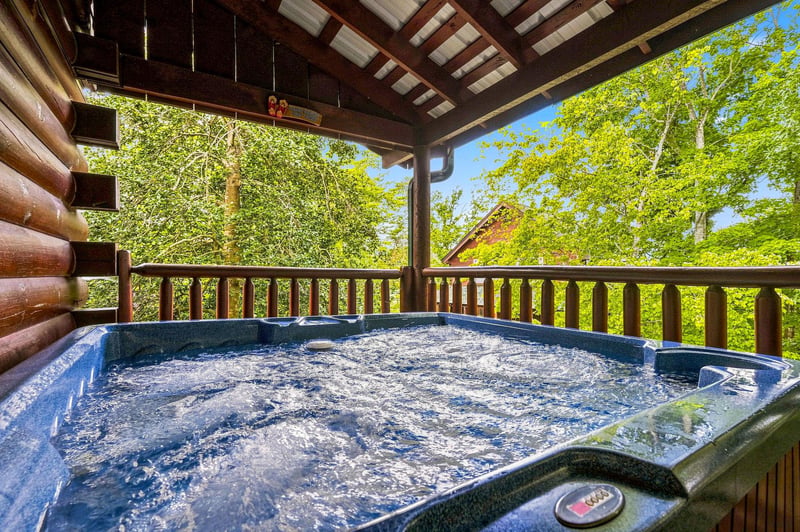 Sink into the bubbling hot tub on your private covered deck, surrounded by lush forest views that bring nature right to your doorstep.